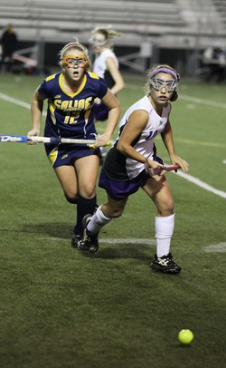 Saline's Annie Carter (left) and Eliza Stein go after the ball as Pioneer took on Saline at Pioneer High School Tuesday October 25, 2011. Pioneer won the game 6-0 and advanced to the semi-finals. Jeff Sainlar I AnnArbor.com