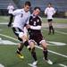 Pioneer's Josh Graves(left) and Joe Myers fight over the ball as Pioneer High School took on University of Detroit Jesuit  at Saline High School Wednesday October 26, 2011. Pioneer won the game 5-1 to advance to the next round. Jeff Sainlar I AnnArbor.com