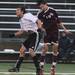 Pioneer's Adam Carn Saferstein(left) and Tyler Ashcraft go for a header as Pioneer High School took on University of Detroit Jesuit  at Saline High School Wednesday October 26, 2011. Pioneer won the game 5-1 to advance to the next round. Jeff Sainlar I AnnArbor.com