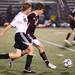 Pioneer's Cal Kirchin(left) and Luke Nittman battle for possesion as Pioneer High School took on University of Detroit Jesuit  at Saline High School Wednesday October 26, 2011. Pioneer won the game 5-1 to advance to the next round. Jeff Sainlar I AnnArbor.com