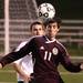 University of Detroit Jesuit's Elias Cueter looks to bring down the ball as Pioneer High School took on University of Detroit Jesuit  at Saline High School Wednesday October 26, 2011. Pioneer won the game 5-1 to advance to the next round. Jeff Sainlar I AnnArbor.com