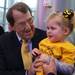 Former Michigan football coach Lloyd Carr meets one of the child patients at the University of Michigan's Mott Children's Hospital ribbon cutting ceremony Thursday November 3, 2011. Jeff Sainlar I AnnArbor.com