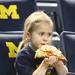 Thora Crawford enjoys a slice of pizza as Michigan took on Ferris State at the Crisler Arena Friday November 11, 2011.Michigan won the game 59-33. (AP Photo/AnnArbor.com, Jeff Sainlar I AnnArbor.com)