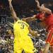 Michigan's Trey Burke completes the bucket despite Jerrell Sander's foul as Michigan took on Ferris State at the Crisler Arena Friday November 11, 2011. Michigan won the game 59-33.(AP Photo/AnnArbor.com, Jeff Sainlar I AnnArbor.com)