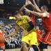 Michigan's Jordan Morgan is swarmed by defenders as Michigan took on Ferris State at the Crisler Arena Friday November 11, 2011. Michigan won the game 59-33. (AP Photo/AnnArbor.com, Jeff Sainlar I AnnArbor.com)
