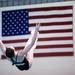 Elena Ghormley performs an acrobatic move as divers from Pioneer, Huron, and Saline participated in diving regionals at Pioneer High School November 15, 2011. Jeff Sainlar I AnnArbor.com