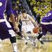 Stu Douglass tries to split the defenders as the University of Michigan men's basketball team took on Western Illinois Thursday November 17, 2011 at the Crisler Arena. Michigan won the game 59-55. Jeff Sainlar I AnnArbor.com
