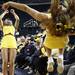 Michigan cheerleaders do backflips as the University of Michigan men's basketball team took on Western Illinois Thursday November 17, 2011 at the Crisler Arena. Michigan won the game 59-55. Jeff Sainlar I AnnArbor.com