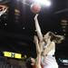 Michigan's Kate Thompson lays the ball up over Chelsea Bridgewater as the University of Michigan women's basketball team took on the University of Utah Utes Thursday November 17, 2011 at the Crisler Arena. Jeff Sainlar I AnnArbor.com