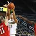 Michigan's Sam Arnold forces the ball over Taryn Wicikoski as the University of Michigan women's basketball team took on the University of Utah Utes Thursday November 17, 2011 at the Crisler Arena. Jeff Sainlar I AnnArbor.com