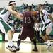 Kamil Janton(left) and J.R. Sims defend Chuck Guy as Eastern Michigan University took on Arkansas Little Rock Friday November 18, 2011 at the Convocation Center. Eastern Michigan won the game  62-51. Jeff Sainlar I AnnArbor.com