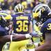 Vincent Smith and Stephen Hopkins get pumped up before the game as the University of Michigan took on Nebraska at Michigan Stadium Saturday November 19, 2011. Jeff Sainlar I AnnArbor.com