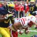 Martavious Odom takes a hit from Jim Ebke as the University of Michigan took on Nebraska at Michigan Stadium Saturday November 19, 2011. Jeff Sainlar I AnnArbor.com