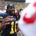 Denard Robinson shakes a hand of a Cornhusker player at the end of the game as the University of Michigan took on Nebraska at Michigan Stadium Saturday November 19, 2011. Michigan won the game 45-17.  Robinson finished the game with four touchdowns. Jeff Sainlar I AnnArbor.com