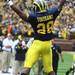 Fitzgerald Toussaint celebrates after scoring a touchdown in the second half as the University of Michigan took on Nebraska at Michigan Stadium Saturday November 19, 2011. Jeff Sainlar I AnnArbor.com