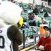 Rochester College fan Palmer Speck has a stare down with Swoop, the Eastern Michigan mascot, as Eastern Michigan University took on Rochester College at the Convocation Center Wednesday November 23, 2011.EMU won the game 62-43. Jeff Sainlar I AnnArbor.com