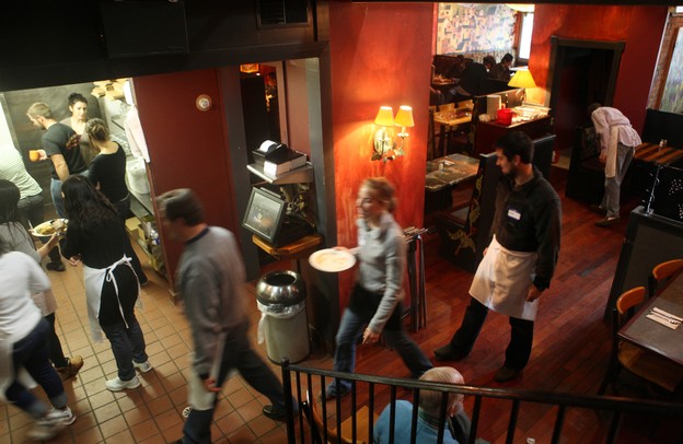 The Original Cottage Inn on William Street in Ann Arbor has been providing free Thanksgiving Day dinner to the less fortunate for the past 28 years. The Cottage Inn staff teamed up with local volunteers to serve an expected 300 guests meals with Thanksgiving favorites like oven roasted turkey, mashed potatoes, gravy, stuffing, veggies and dessert on Thursday. Jeff Sainlar I AnnArbor.com