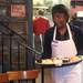 Elizabeth Namundyebo helps pass out food at the Cottage Inn. Namundyebo just came to the United States from Nyumba six months ago.  The Original Cottage Inn on William St. has been providing free Thanksgiving Day dinner to the less fortunate for the past 28 years. The Cottage Inn staff teamed up with local volunteers to serve an expected 300 guests meals with Thanksgiving favorites like oven roasted turkey, mashed potatoes, gravy, stuffing, veggies, and dessert on Thursday November 24, 2011.Jeff Sainlar I AnnArbor.com