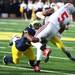 Thomas Gordon(left) helps take down Ohio State's Braxton Miller as the University of Michigan took on Ohio State Saturday  November 26, 2011 at Michigan Stadium. Michigan won the game 40-34. Jeff Sainlar I AnnArbor.com