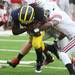 Denard Robinson runs through defenders as the University of Michigan took on Ohio State Saturday  November 26, 2011 at Michigan Stadium. Michigan won the game 40-34. Robinson finished the game with 170 rushing yards and two touchdowns. Jeff Sainlar I AnnArbor.com