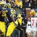 Kevin Koger celebrates with Brandon Moore after Koger's touchdown as the University of Michigan took on Ohio State Saturday  November 26, 2011 at Michigan Stadium. Michigan won the game 40-34. Jeff Sainlar I AnnArbor.com