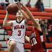 Milan's Samantha Coon lays it up over Marta Formoso Prada as Milan took on Whitmore Lake at Milan High School Tuesday November 29, 2011. Milan won the game 36-33.  Jeff Sainlar I AnnArbor.com