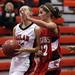 Milan's McKenzie Mitchell drives to the basket despite Mariah Duffy's defense as Milan took on Whitmore Lake at Milan High School Tuesday November 29, 2011. Milan won the game 36-33.  Jeff Sainlar I AnnArbor.com