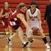 Milan's Samantha Coon(right) and Sarah Kirchner battle for the ball as Milan took on Whitmore Lake at Milan High School Tuesday November 29, 2011. Milan won the game 36-33.  Jeff Sainlar I AnnArbor.com