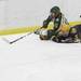 Huron's Andrew Gasparovich(11) fights for possession on the ice with Jake Corden as Ann Arbor Huron took on Grosse Pointe South  Wednesday November 30, 2011 at the Ann Arbor Ice Cube. Grosse Pointe South won 8-1. Jeff Sainlar I AnnArbor.com