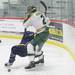 Huron's Nick Sorsher lays out a Grosse Point South player as Ann Arbor Huron took on Grosse Pointe South  Wednesday November 30, 2011 at the Ann Arbor Ice Cube. Grosse Pointe South won 8-1. Jeff Sainlar I AnnArbor.com