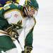 Huron's Andrew Gasparovich eyes the puck as Ann Arbor Huron took on Grosse Pointe South  Wednesday November 30, 2011 at the Ann Arbor Ice Cube. Grosse Pointe South won 8-1. Jeff Sainlar I AnnArbor.com