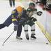 Brad Kohut(left) lays a hit on Tanner Bahlow as Ann Arbor Huron took on Grosse Pointe South  Wednesday November 30, 2011 at the Ann Arbor Ice Cube. Grosse Pointe South won 8-1. Jeff Sainlar I AnnArbor.com