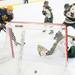 A Grosse Point South player gets the puck past Bobby Coulter for one of their many goals as Ann Arbor Huron took on Grosse Pointe South  Wednesday November 30, 2011 at the Ann Arbor Ice Cube. Grosse Pointe South won 8-1. Jeff Sainlar I AnnArbor.com