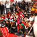 Kids and their papents listen to Santa as he read "The Night Before Christmas" as Santa Claus' bus tour stopped in at the Macy's in Briarwood Mall Tuesday  December 6, 201. The purpose of the bus tour is to raise awareness of Macy's Believe campaign, which benefit?s Make-A-Wish.  Jeff Sainlar I AnnArbor.com