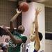 Father Gabriel Richar's Evan Fosha shoots over Jibreel Hussein as Ann Arbor Pioneer took on Father Gabriel Richard  Tuesday  December 6, 2011 at Pioneer High School. Pioneer won the game 70-34. Jeff Sainlar I AnnArbor.com