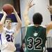 Pioneer captain Jimmy Holman shoots it over Mark Tanski as Ann Arbor Pioneer took on Father Gabriel Richard  Tuesday  December 6, 2011 at Pioneer High School. Pioneer won the game 70-34. Jeff Sainlar I AnnArbor.com
