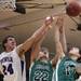 Pioneer's Nick Rakic(24) fights over a rebound with Drew Diedrich(22) and Clay Spore as Ann Arbor Pioneer took on Father Gabriel Richard  Tuesday  December 6, 2011 at Pioneer High School. Pioneer won the game 70-34. Jeff Sainlar I AnnArbor.com