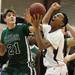 Jason Houle(left) and Tevis Robinson battle for a loose ball as Ann Arbor Pioneer took on Father Gabriel Richard  Tuesday  December 6, 2011 at Pioneer High School. Pioneer won the game 70-34. Jeff Sainlar I AnnArbor.com