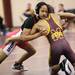 Milan's Xena Pennington tries to take down Manchester's Robert Stamp as Saline, Manchester, Clinton, and Milan participated in a quad meet Wednesday  December 7, 2011 at Manchester High School. Jeff Sainlar I AnnArbor.com