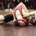 Manchester's Eric Cuval tries to make a move on a Milan wrestler as Saline, Manchester, Clinton, and Milan participated in a quad meet Wednesday  December 7, 2011 at Manchester High School. Jeff Sainlar I AnnArbor.com
