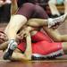 A Milan wrestler is chocked by a Manchester player as Saline, Manchester, Clinton, and Milan participated in a quad meet Wednesday  December 7, 2011 at Manchester High School. Jeff Sainlar I AnnArbor.com