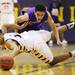 Ypsilanti's Derrick Richardson lays out for ball after stealing it from Giovanni Wasson as Ann Arbor Pioneer took on Ypsilanti Friday December 9, 2011 at Ypsilanti High School. Ypsilanti won the game convincingly 70-38. Jeff Sainlar I AnnArbor.com