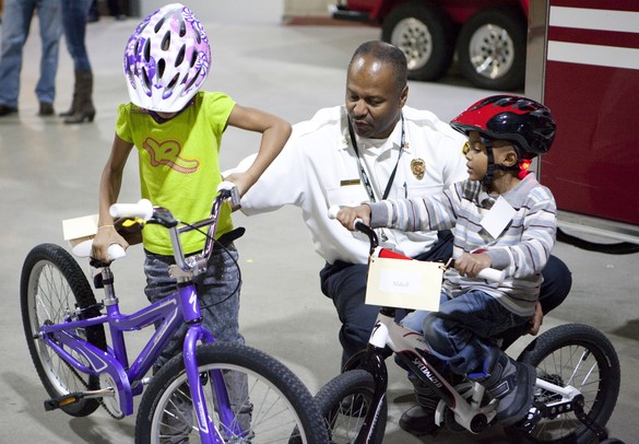 Holiday giving: Ann Arbor firefighters invite kids to party - and send them  home with new bikes