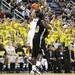 Trey Burke pulls up for a three-pointer in front of the student section as the Michigan men's basketball team took on Arkansas Pine-Bluff at the Crisler Arena Tuesday December 13, 2011. Michigan won the game 63-50. Jeff Sainlar I AnnArbor.com