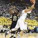 Jordan Morgan makes a move in front of Savalace Townsend as the Michigan men's basketball team took on Arkansas Pine-Bluff at the Crisler Arena Tuesday December 13, 2011. Michigan won the game. Jeff Sainlar I AnnArbor.com