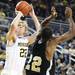 Blake McLimans pulls up for a jump shot over Mitchell Anderson as the Michigan men's basketball team took on Arkansas Pine-Bluff at the Crisler Arena Tuesday December 13, 2011. Michigan won the game 63-50. Jeff Sainlar I AnnArbor.com