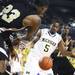 While falling out of bounds Savalace Townsend(left) throws the ball off Michigan's Eso Akunne  as the Michigan men's basketball team took on Arkansas Pine-Bluff at the Crisler Arena Tuesday December 13, 2011. Michigan won the game. Jeff Sainlar I AnnArbor.com