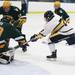 Chelsea's Jacob Ryan(7)  tries to get the puck past David Mayo as Chelsea High School took on Jackson Lumen Christi Wednesday December 14, 2011 at the Chelsea Arctic Coliseum. Chelsea won 6-5.  Jeff Sainlar I AnnArbor.com