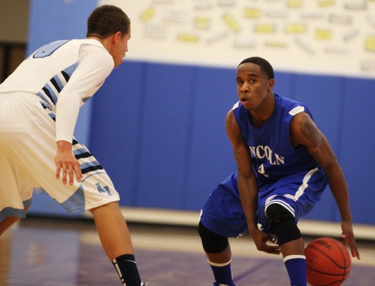 Lincoln's Dimitris Harper-Wilson looks for an open teammate as Skyline took on Ypsilanti Lincoln at Skyline High School Thursday December 15, 2011. Skyline won the game 54-51.  Jeff Sainlar I AnnArbor.com