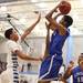 Lincoln's Christopher Williams shoots over Theron Wilson as Skyline took on Ypsilanti Lincoln at Skyline High School Thursday December 15, 2011. Skyline won the game 54-51.  Jeff Sainlar I AnnArbor.com